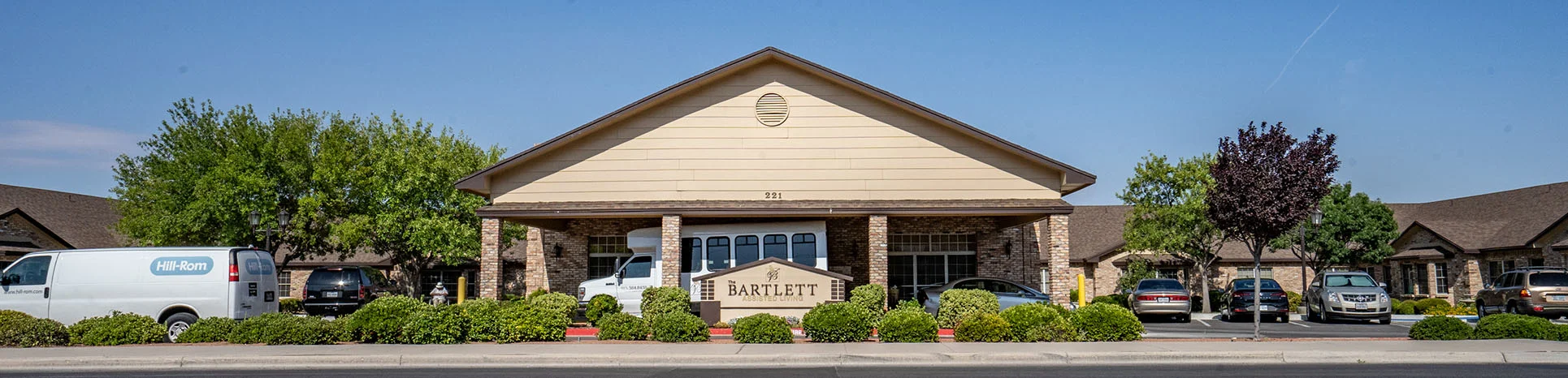 The Bartlett's front entrance, landscaped grounds and covered driveway in El Paso